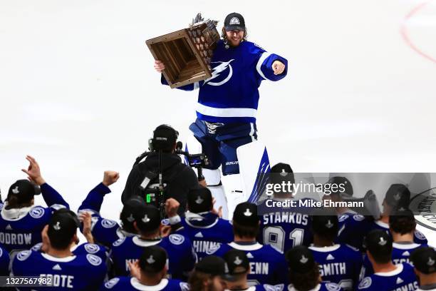 Andrei Vasilevskiy of the Tampa Bay Lightning is presented with the Conn Smythe Trophy after defeating the Montreal Canadiens 1-0 in Game Five to win...