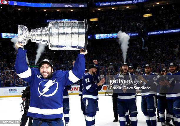 Tyler Johnson of the Tampa Bay Lightning hoists the Stanley Cup after their 1-0 win in Game Five of the 2021 Stanley Cup Final to win the series four...