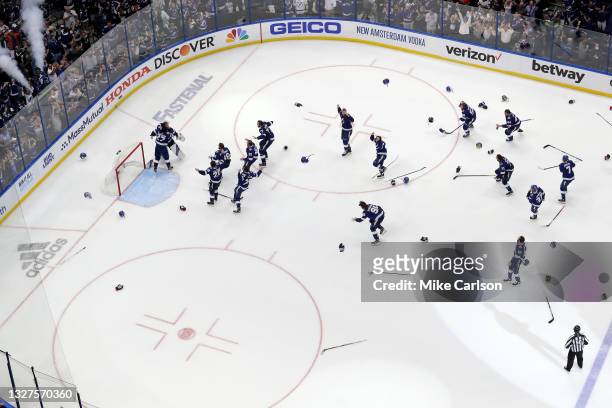 The Tampa Bay Lightning celebrate after defeating the Montreal Canadiens 1-0 in Game Five to win the 2021 NHL Stanley Cup Final at Amalie Arena on...