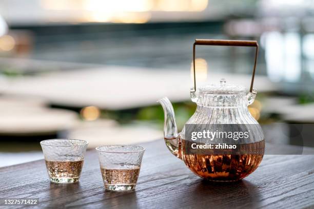 teapot and cups on the coffee table - ティーポット ストックフォトと画像