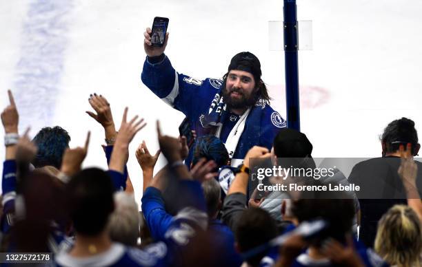 Pat Maroon of the Tampa Bay Lightning points his mobile phone toward the fans after the Lightning 1-0 victory in Game Five of the 2021 Stanley Cup...