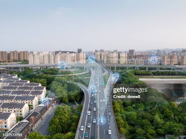 smart transportation with motorway intersection - ciudad inteligente fotografías e imágenes de stock