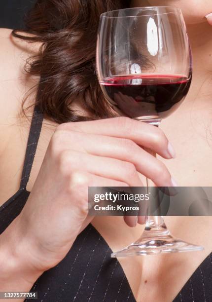 female drinking red wine - wine glass finger food stock-fotos und bilder