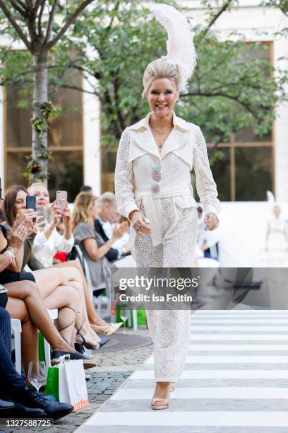 Laura Karasek walks the runway during the Charity Hairshow of Haarwerk as part of the first Frankfurt Fashion Week Spring/Summer 2022 at Open Air...