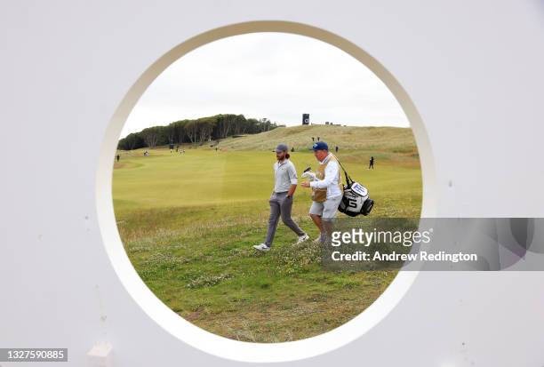 Tommy Fleetwood of England walks off the 12th green during Day One of the abrdn Scottish Open at The Renaissance Club on July 08, 2021 in North...