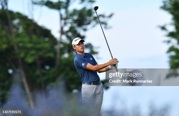 Collin Morikawa of the United States plays his second shot on the 1st hole during Day One of the abrdn Scottish Open at The Renaissance Club on July...