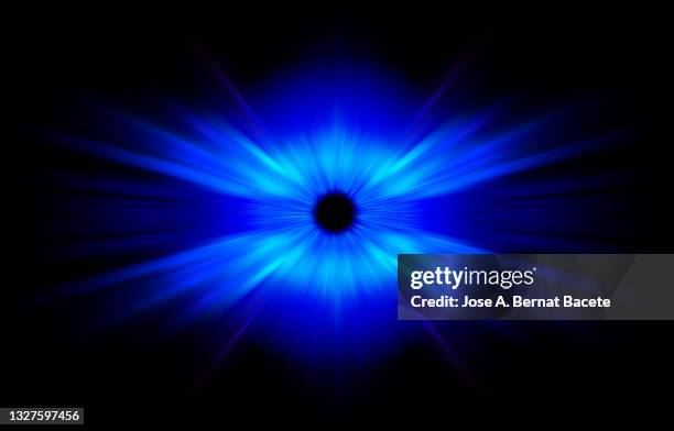 abstract background with blue light trails attracted by a black hole on a black background. - concentric stock pictures, royalty-free photos & images
