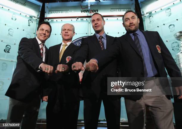 Hall of Fame inductees Doug Gilmour, Mark Howe, Joe Nieuwendyk and Ed Belfour show off their Hall of Fame rings during a photo opportunity at the...