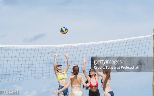 asian women in swimsuits at the beach. happy island lifestyle - beach volleyball group stock pictures, royalty-free photos & images