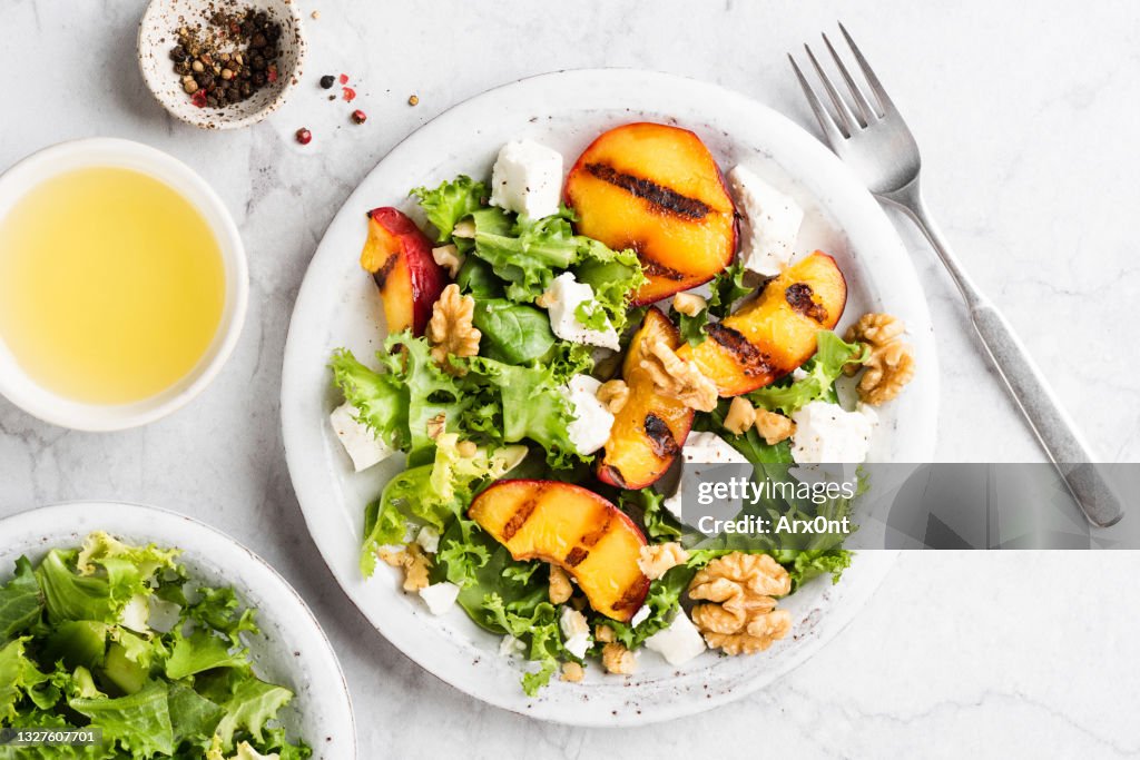 Summer salad with grilled peaches and feta cheese