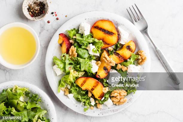 summer salad with grilled peaches and feta cheese - lettuce stock pictures, royalty-free photos & images