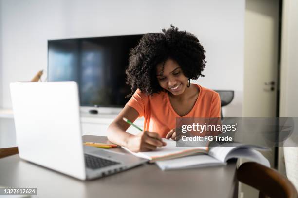teenager girl studying at home - girl distance learning stock pictures, royalty-free photos & images