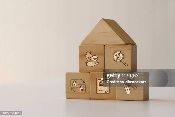 real estate icons on wooden blocks - photo buying sites stock pictures, royalty-free photos & images