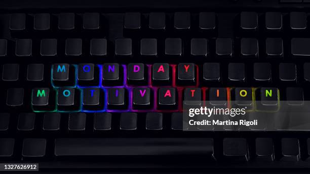 monday motivation - written on rgb backlit keyboard, closeup - monday stock pictures, royalty-free photos & images