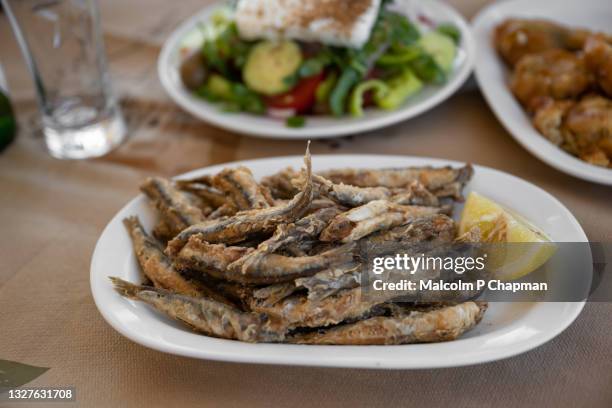 fried anchovies (gavros) as park of a greek lunch, lesvos, greece - greek food imagens e fotografias de stock