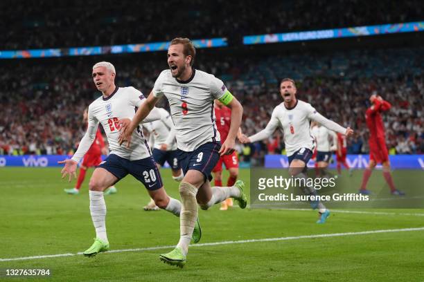 Harry Kane of England is congratulated by Phil Foden after scoring the second goal during the UEFA Euro 2020 Championship Semi-final match between...