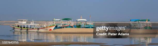 boats moored on the the chindwin river, myanmar - chindwin stock pictures, royalty-free photos & images