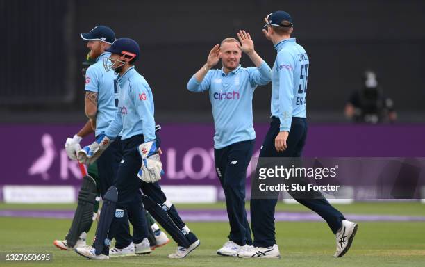 England bowler Matt Parkinson celebrates with team mates after taking the wicket of Pakistan batsman Hassan Ali during the 1st Royal London Series...