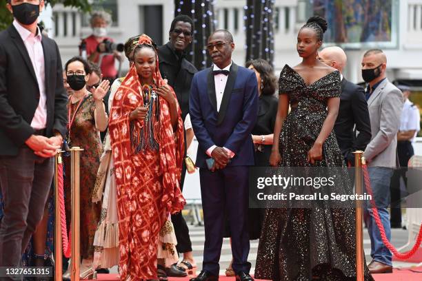 Achouackh Abakar, director Mahamat-Saleh Haroun and Rihane Khalil Alio attend the "Lingui" screening during the 74th annual Cannes Film Festival on...