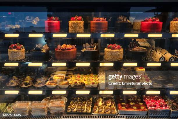 shop window full of sweet food variety in cesme. - pasticceria foto e immagini stock