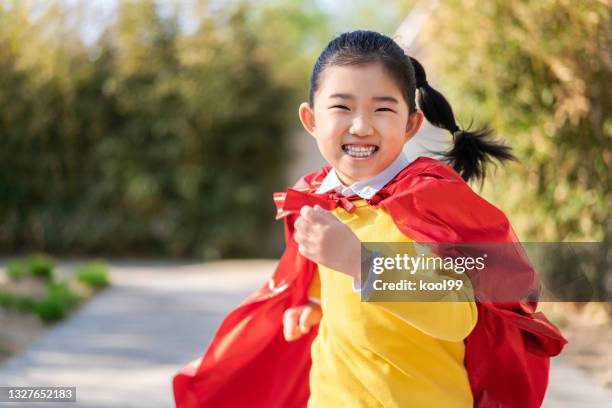 supergirl running - cosplay stock pictures, royalty-free photos & images