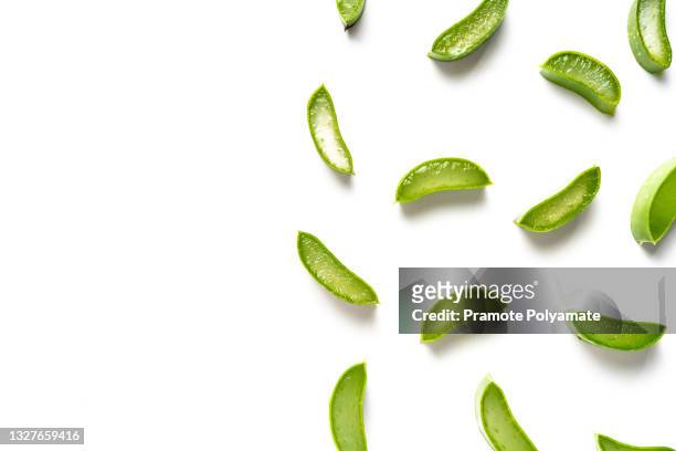 flat lay (top view) of aloe vera sliced isolated on white background. - aloe slices stock pictures, royalty-free photos & images