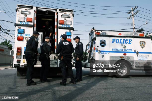 Police gather at a crime scene following a stand-off in front of the 45th Police Precinct in the Bronx on July 08, 2021 in New York City. An armed...