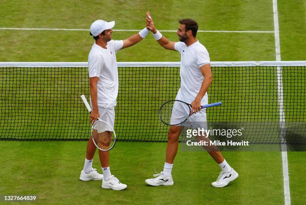Marcel Granollers of Spain and playing partner Horacio Zeballos of Argentina celebrate victory after winning their Men's Doubles Semi-Final match...