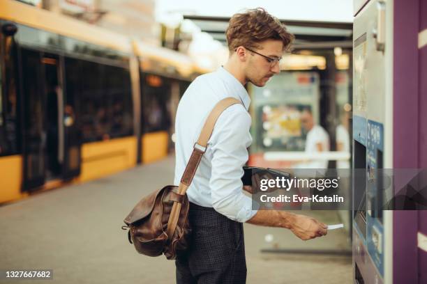 young businessman in the city - train ticket stock pictures, royalty-free photos & images