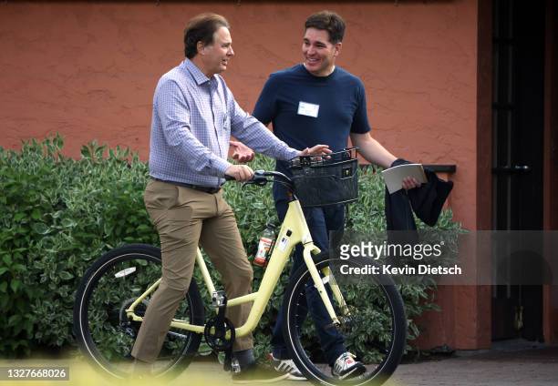 Private equity investor and co-chairman of Bain Capital Stephen Pagliuca and CEO of WarnerMedia Jason Kilar walk together at the Allen & Company Sun...