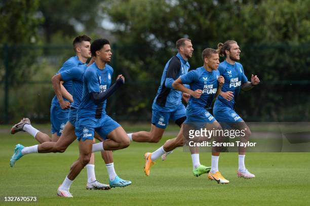 Kelland Watts, Jamal Lewis, Florian Lejuene, Dwight Gayle and Jeff Hendrick sprint during the Newcastle United Training session at the Newcastle...