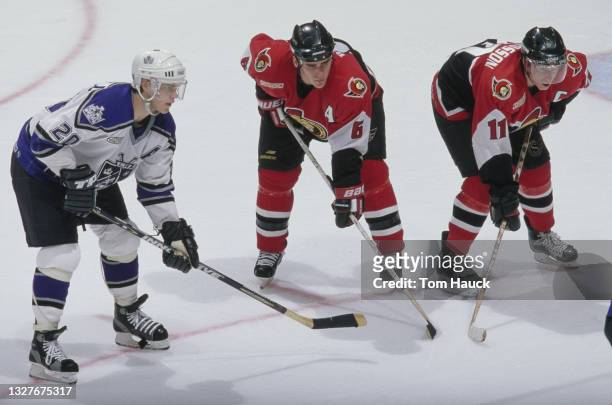 Daniel Alfredsson, Captain and Right Wing and Sami Salo for the Ottawa Senators set for the face off with Luc Robitaille, Left Wing for the Los...