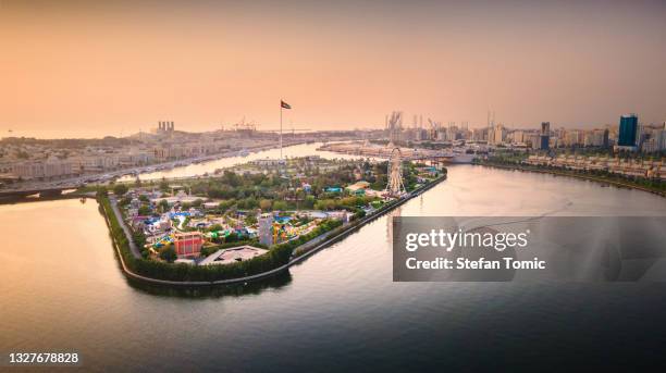 flag island at emirate of sharjah downtown in the united arab emirates - uae flag stock pictures, royalty-free photos & images