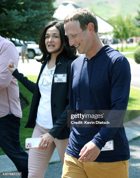 Of Facebook Mark Zuckerberg walks with COO of Facebook Sheryl Sandberg after a session at the Allen & Company Sun Valley Conference on July 08, 2021...