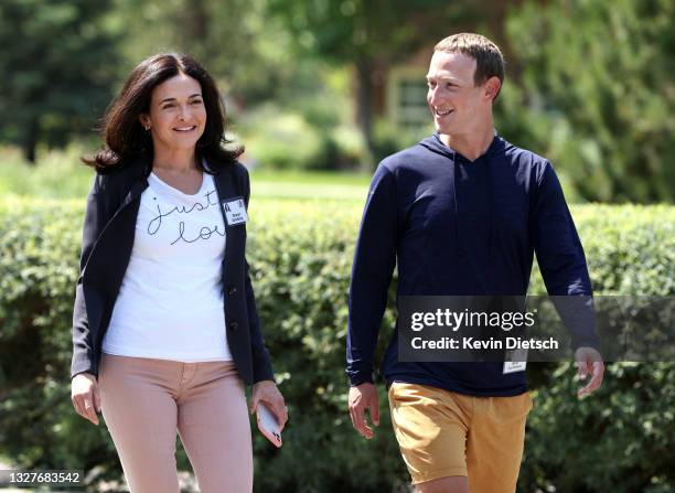 Of Facebook Mark Zuckerberg walks with COO of Facebook Sheryl Sandberg after a session at the Allen & Company Sun Valley Conference on July 08, 2021...