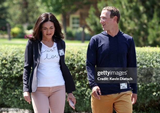 Of Facebook Mark Zuckerberg walks with COO of Facebook Sheryl Sandberg after a session at the Allen & Company Sun Valley Conference on July 08, 2021...