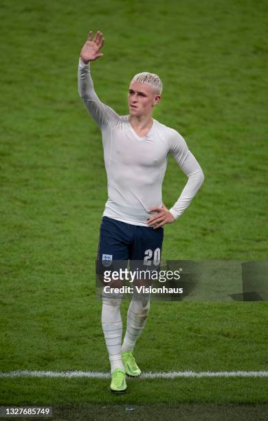 Phil Foden of England waves to the crowd after the UEFA Euro 2020 Championship Semi-final match between England and Denmark at Wembley Stadium on...