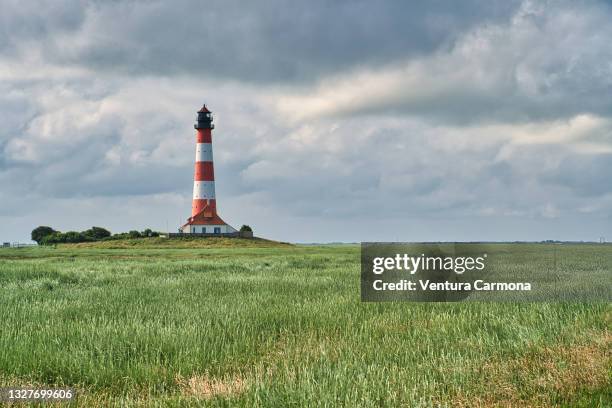 the westerheversand lighthouse, germany - north frisia stock pictures, royalty-free photos & images