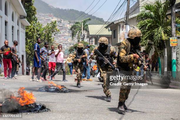 Citizens take part in a protest near the police station of Petion Ville after Haitian president Jovenel Moïse was murdered on July 08, 2021 in...