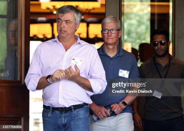 Apple's senior vice president of Internet Software and Services Eddy Cue and Apple CEO Tim Cook attend the Allen & Company Sun Valley Conference on...