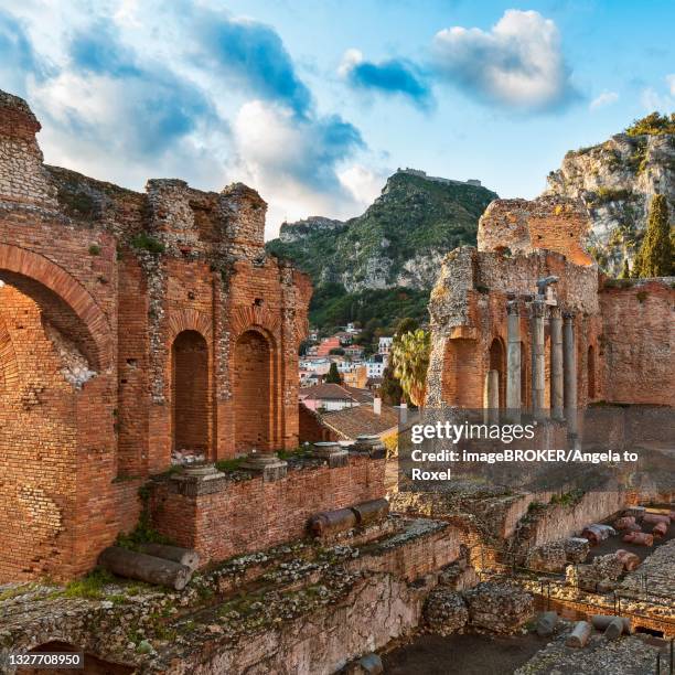 ancient theatre, teatro greco in the evening light, taormina, messina province, sicily, italy - messina stock pictures, royalty-free photos & images