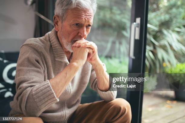 tough times - sighing stock pictures, royalty-free photos & images