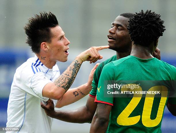 Slovakia's captain Marek Hamsik argues with Cameroon's Sebastian Bassong and Georges Mandejck during their friendly football match in the Hypo Arena...