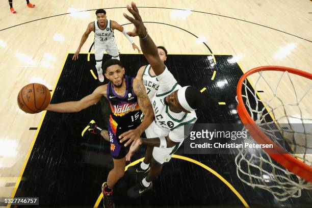 Cameron Payne of the Phoenix Suns attempts a shot against Bobby Portis of the Milwaukee Bucks in the first half of game two of the NBA Finals at...