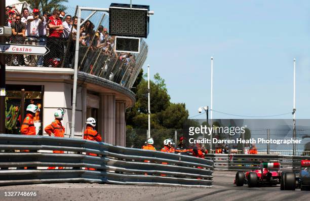 Spanish Scuderia Ferrari Formula One racing driver Fernando Alonso driving his F150˚ racing car, chased by British McLaren driver Jenson Button,...