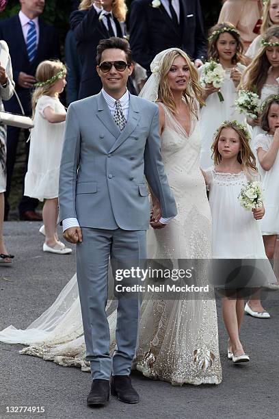 Kate Moss and Jamie Hince outside St Peter's churh after their wedding ceremony on July 1, 2011 in [Southrop], England.