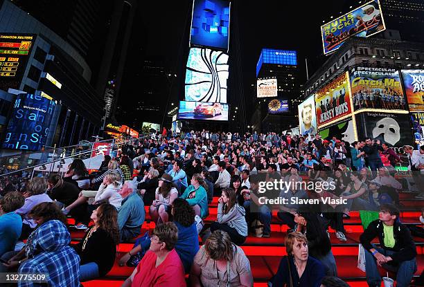 Fans attend the Times Square simulcast of the 65th Annual Tony Awards in Times Square on June 12, 2011 in New York City.