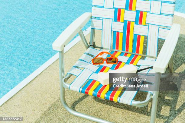 1980s summer background with brick phone, webbed lawn chair next to pool, 90s summer vacation - 90s background stock pictures, royalty-free photos & images