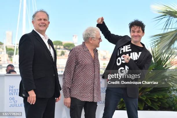 Producer David P. Kelly, Producer Jeremy Thomas and Director Mark Cousins attends "The Storms of Jeremy Thomas" photocall during the 74th annual...