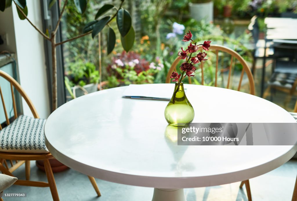 Flowers in glass vase on kitchen table